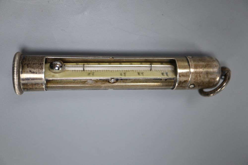 An early 20th century sterling mounted ivory cylindrical thermometer, with swivelling column, 11.2cm.